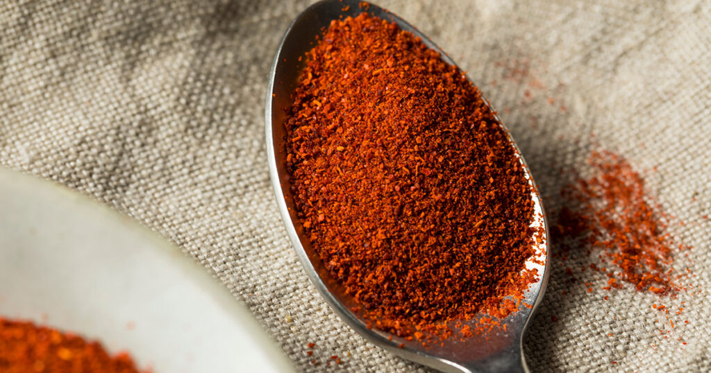 Smoked paprika powder on spoon